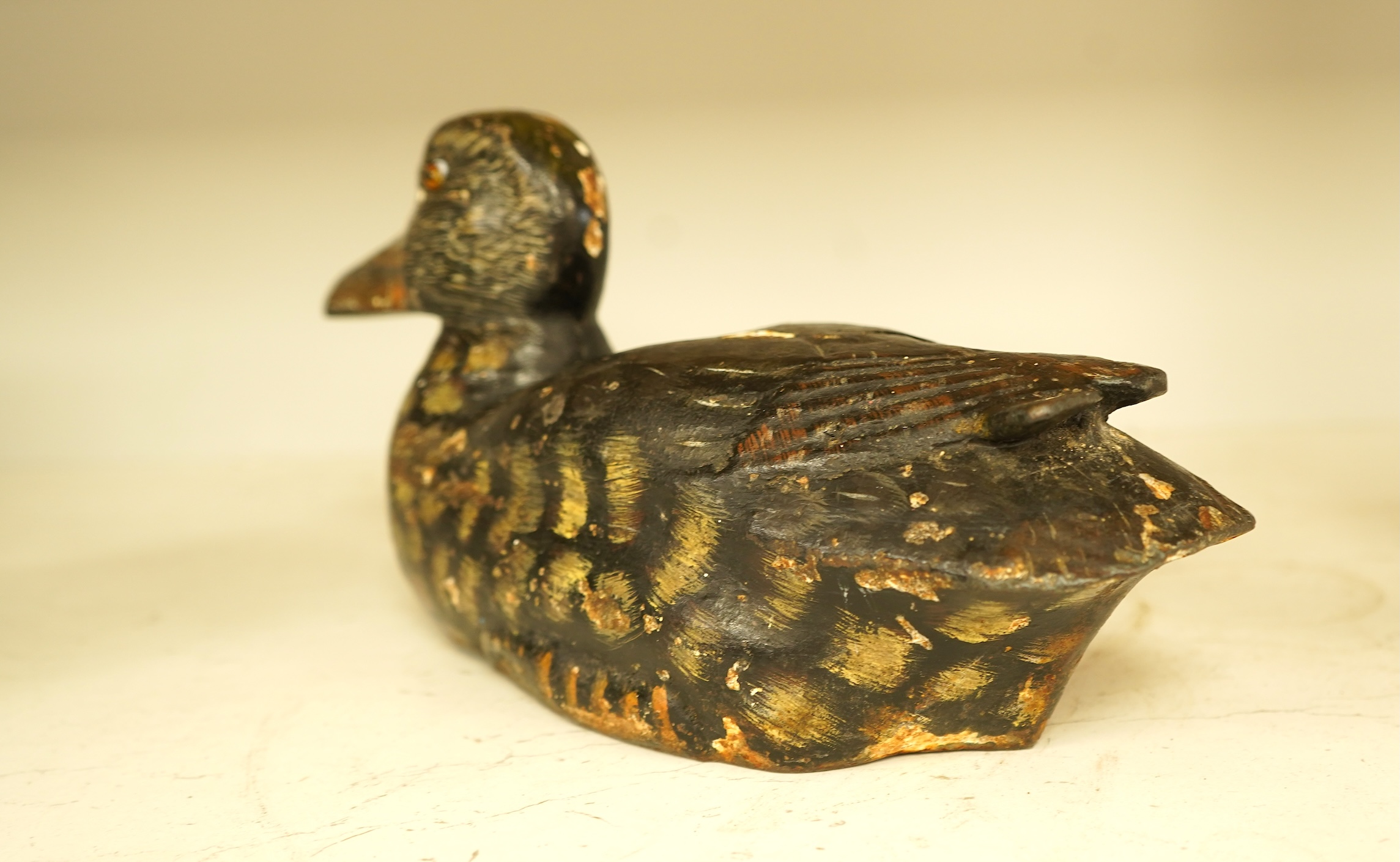 A novelty cast iron doorstop in the form of a duck, 32cm wide